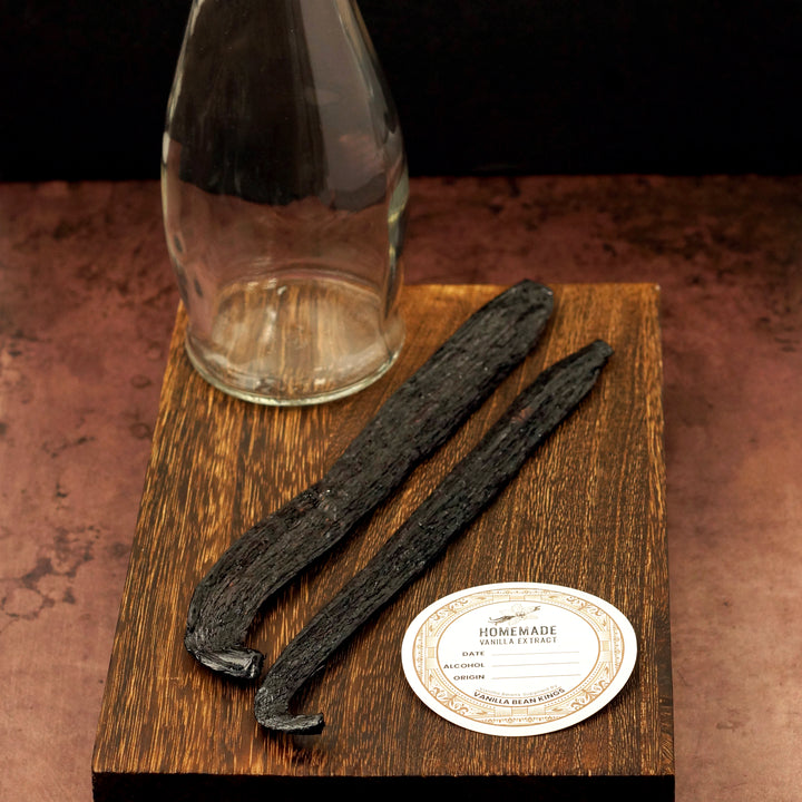 2 vanilla beans with glass bottle