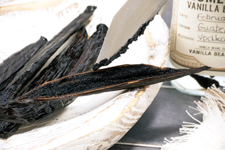 guatemala vanilla bean split with caviar displayed on knife