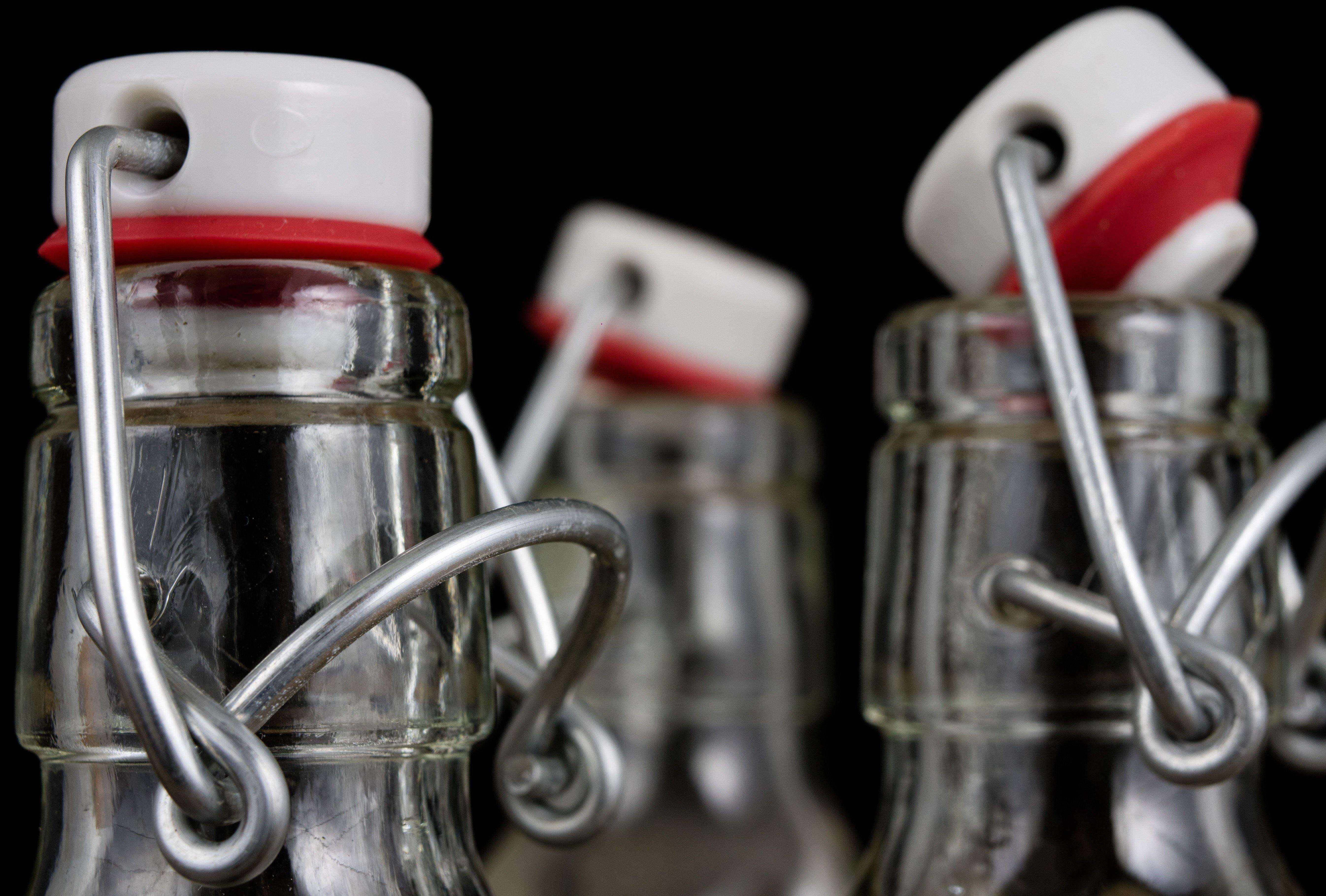 close up image of stainless steel swing top lid for bottle