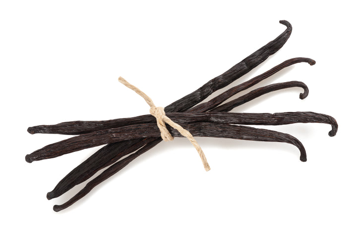 small bundle of vanilla beans with rafia