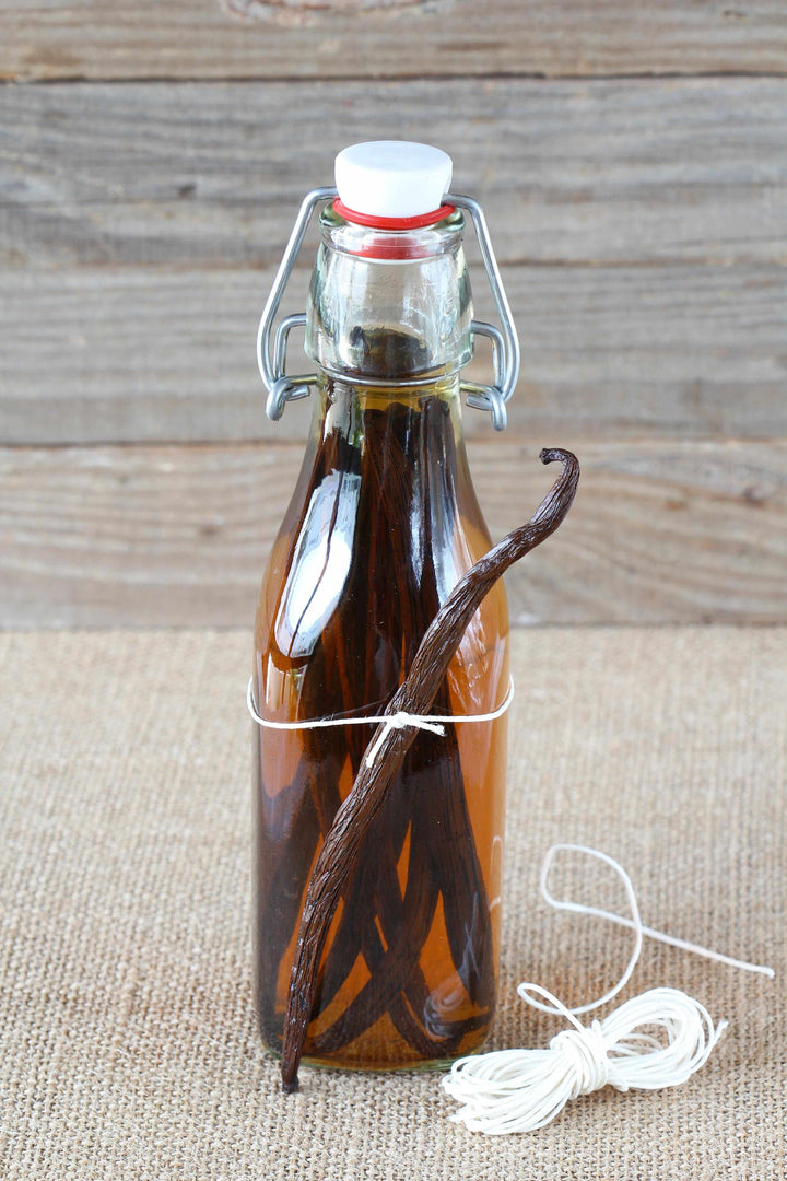 vanilla beans in jar with alcohol