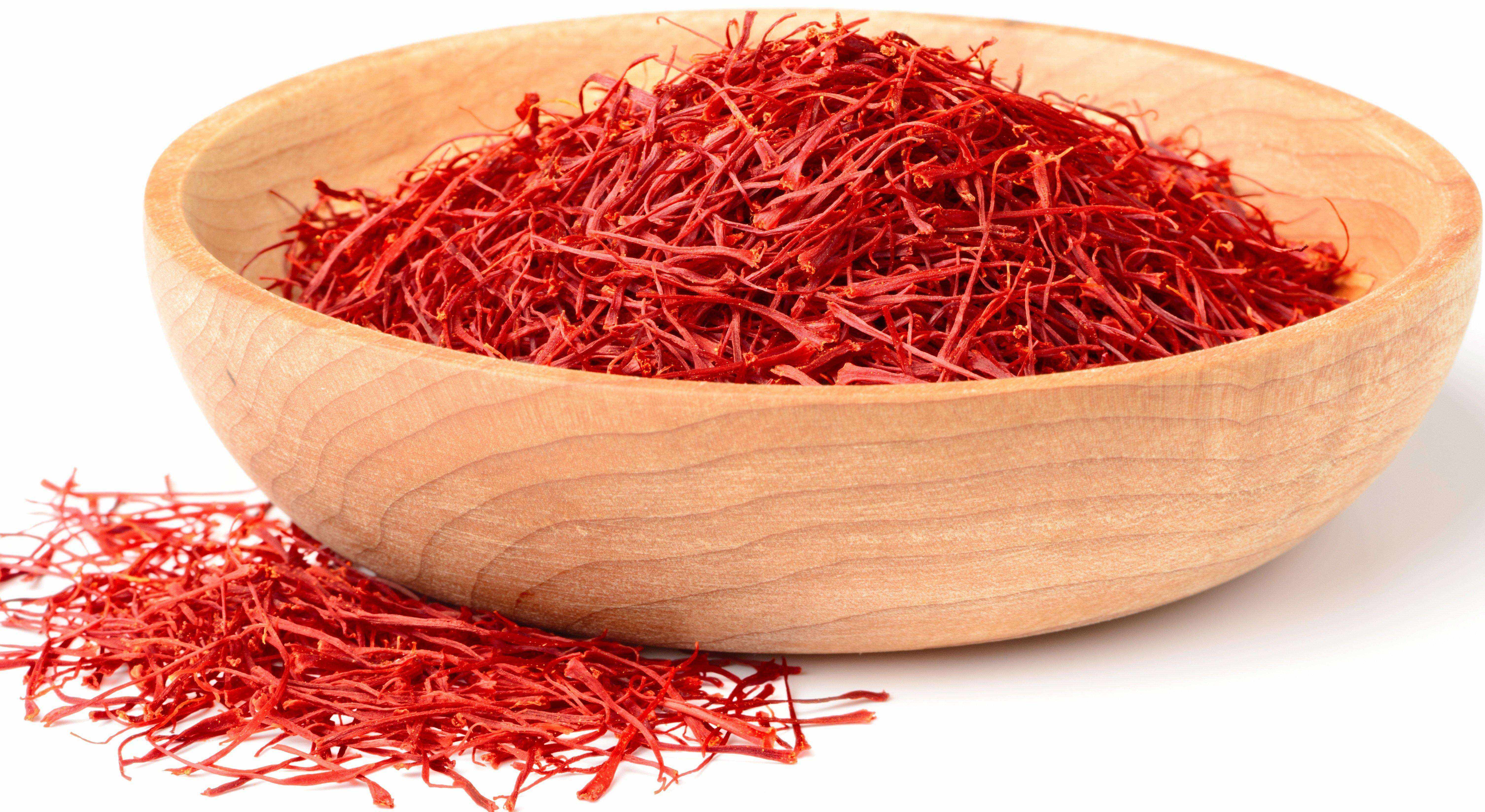 saffron threads in wooden bowl