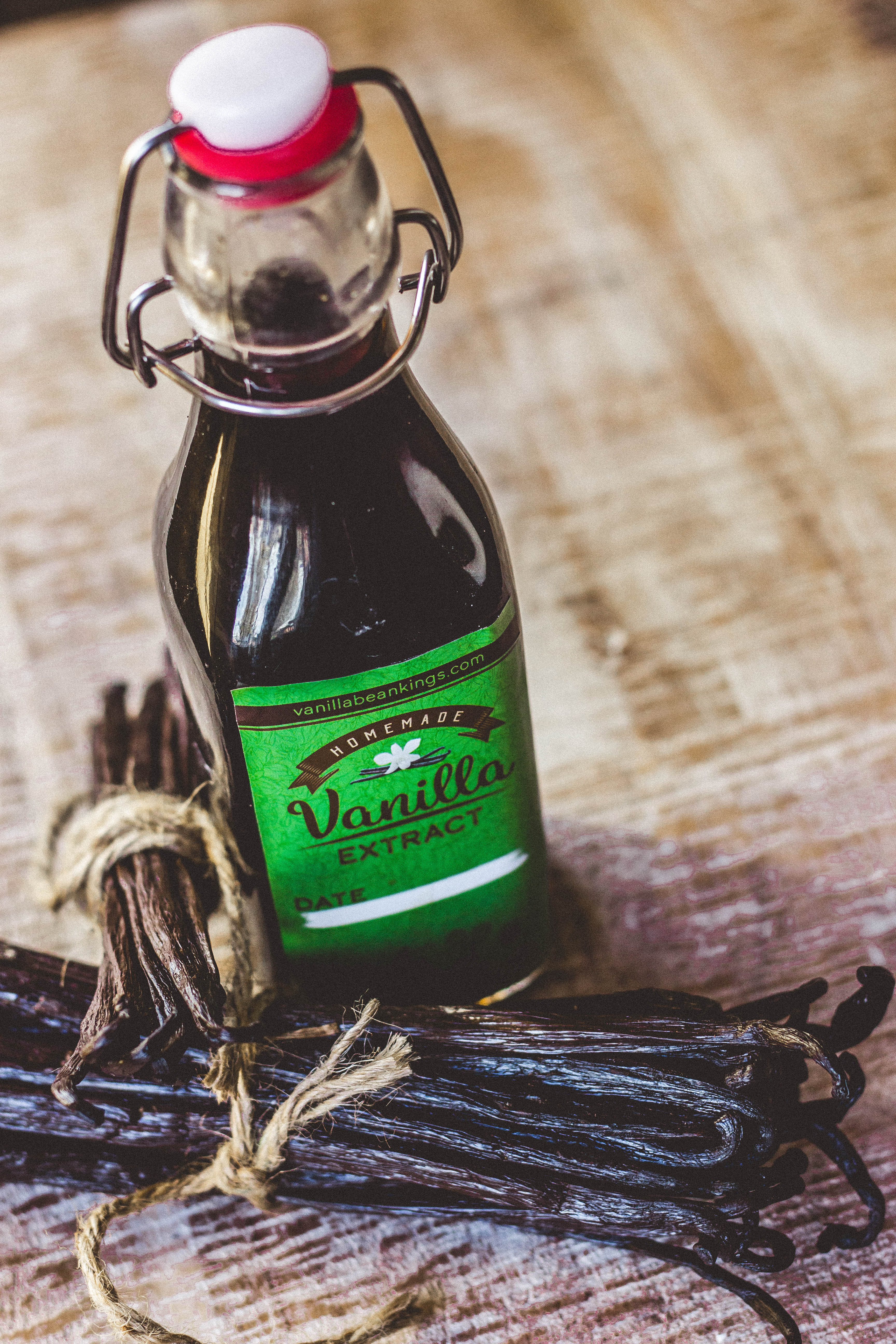 bundle of vanilla beans with bottle of homemade vanilla extract