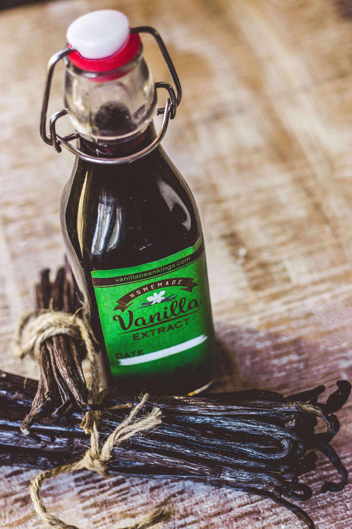 8.5 ounce swing top glass bottle of vanilla extract and vanilla beans