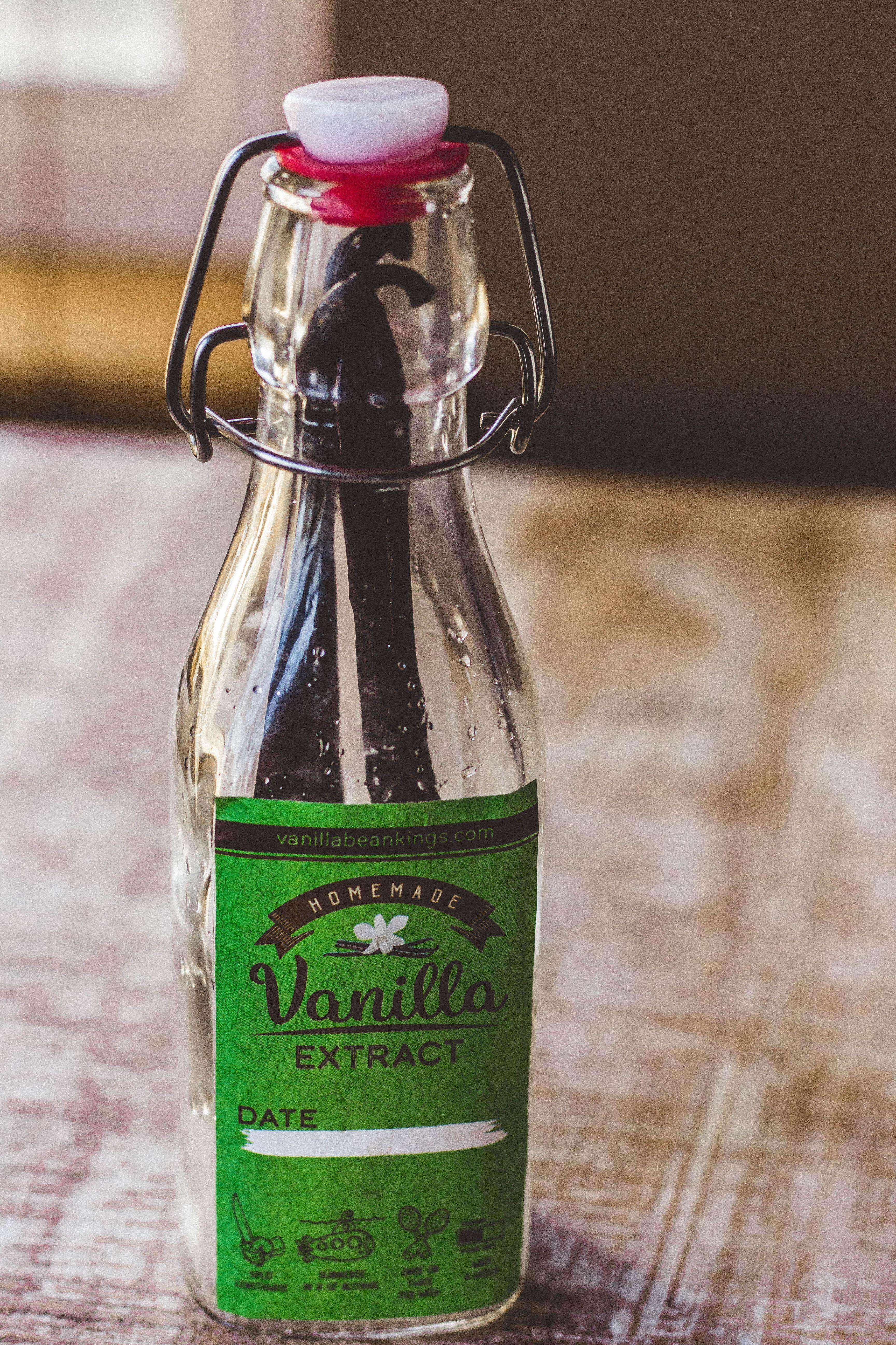 Homemade vanilla extract kit with a bundle of vanilla beans on the side