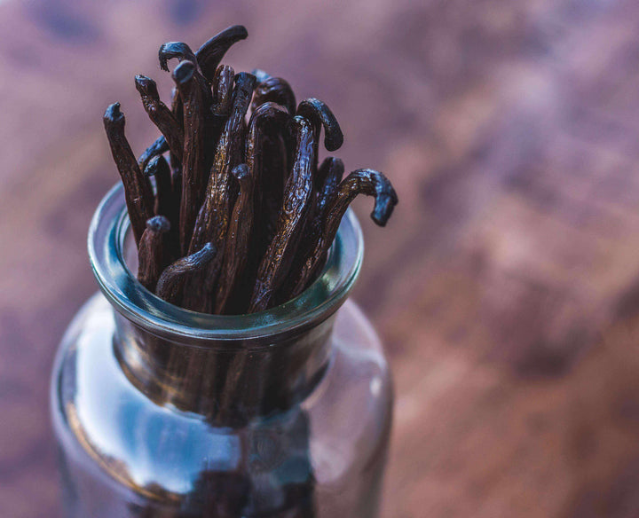 close up of vanilla beans in jar