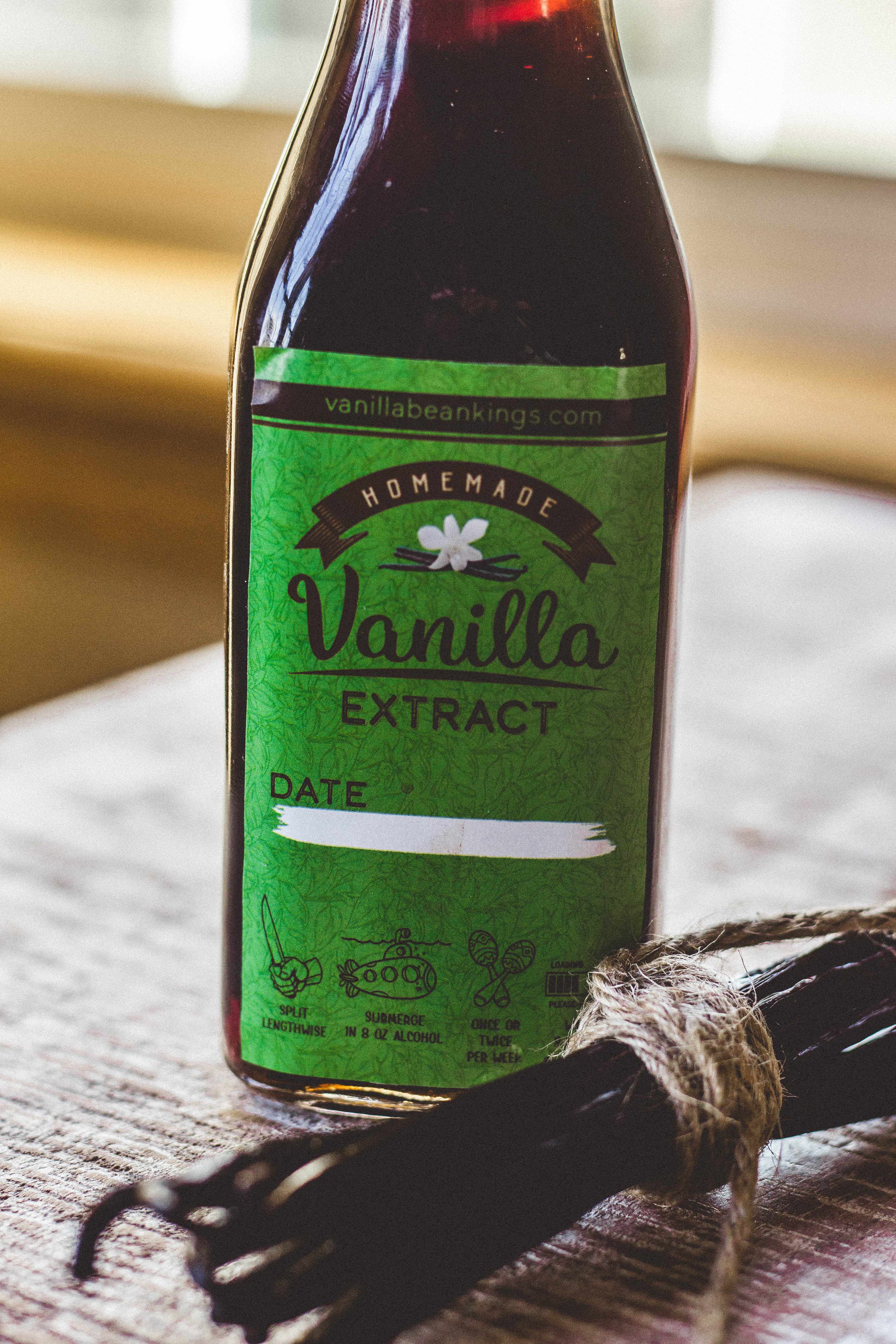 Homemade vanilla extract kit with a bundle of vanilla beans on the side