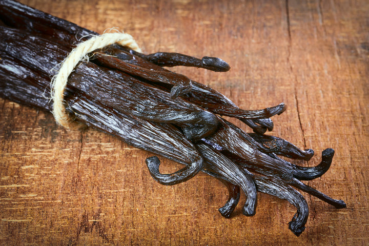 close up image of grade A vanilla beans in bundle